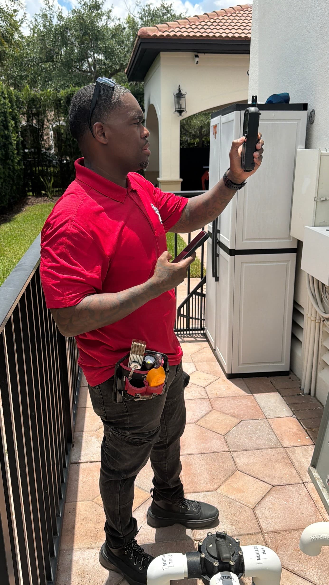 Prolific Home Inspections founder inspecting outdoor equipment on site
