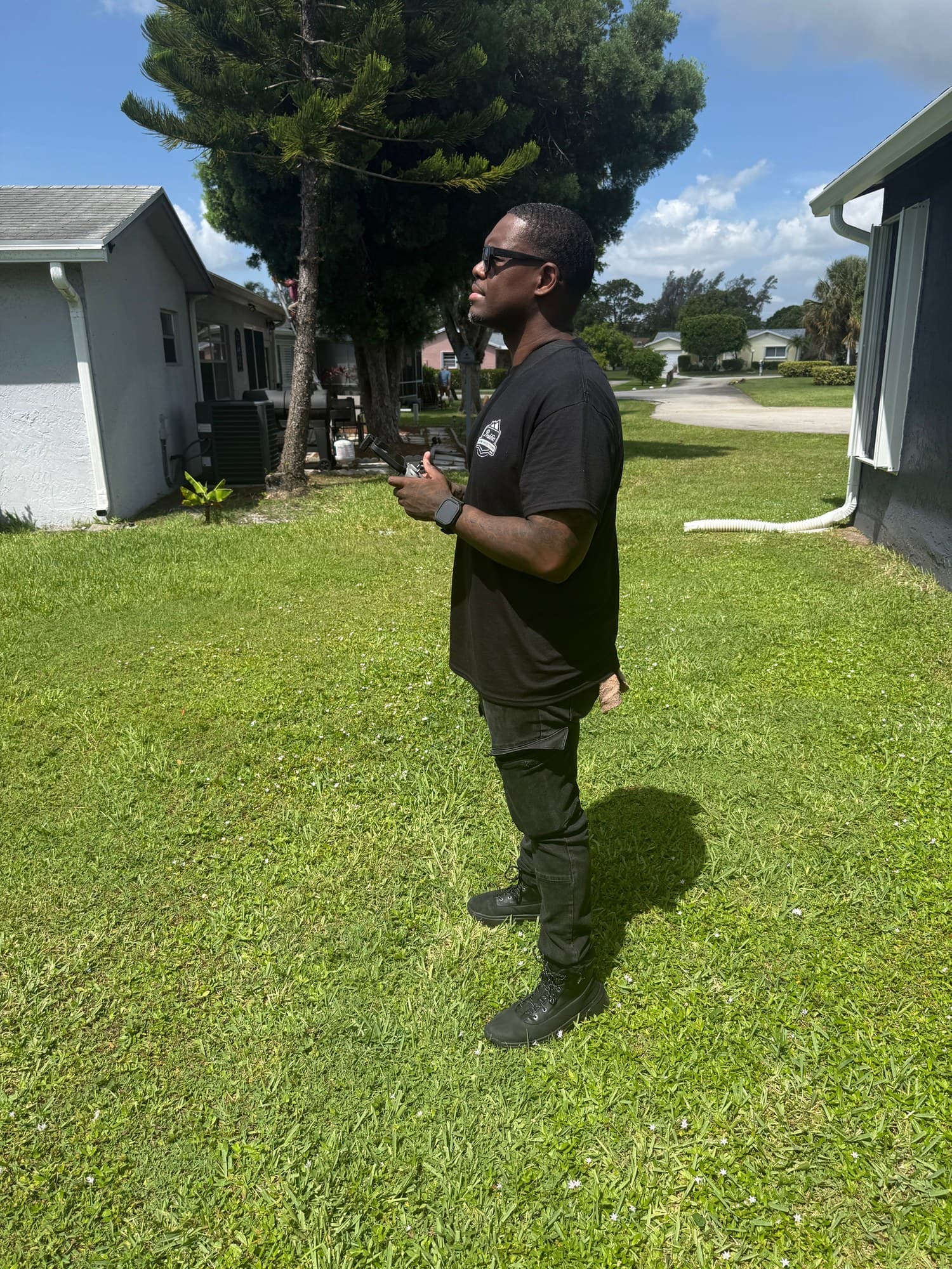 Prolific Home Inspections specialist operating a drone during a field inspection